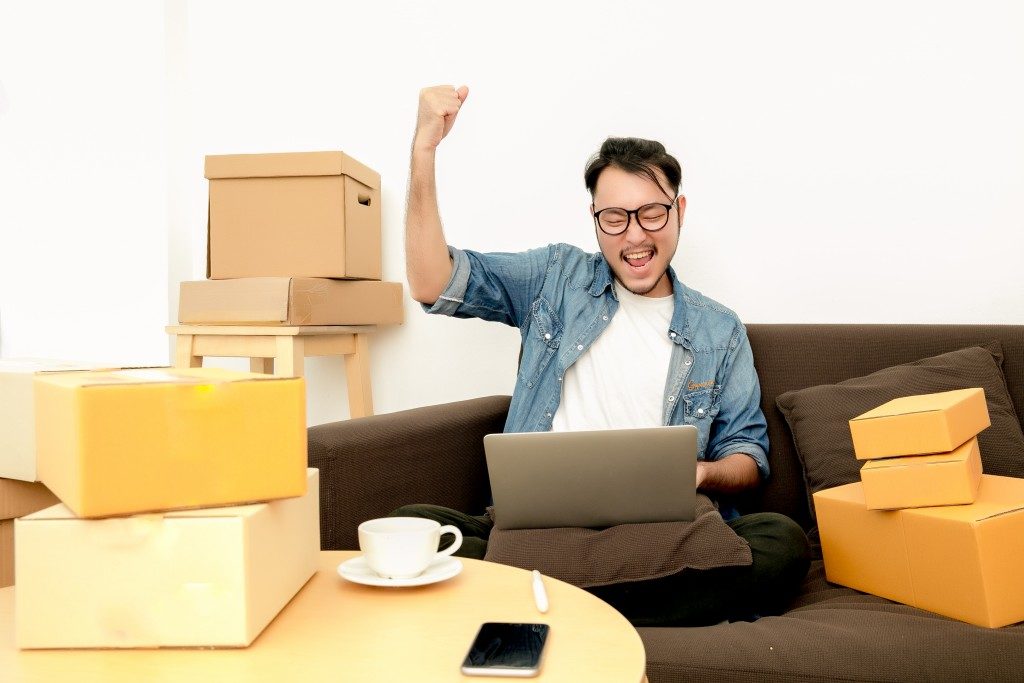 Man happy with boxes