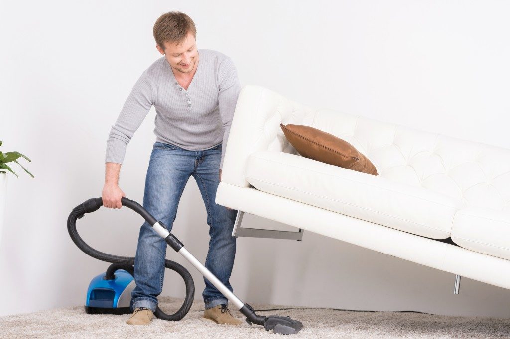 Man cleaning carpet