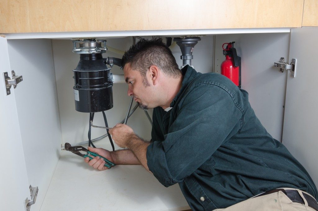 plumber doing maintenance