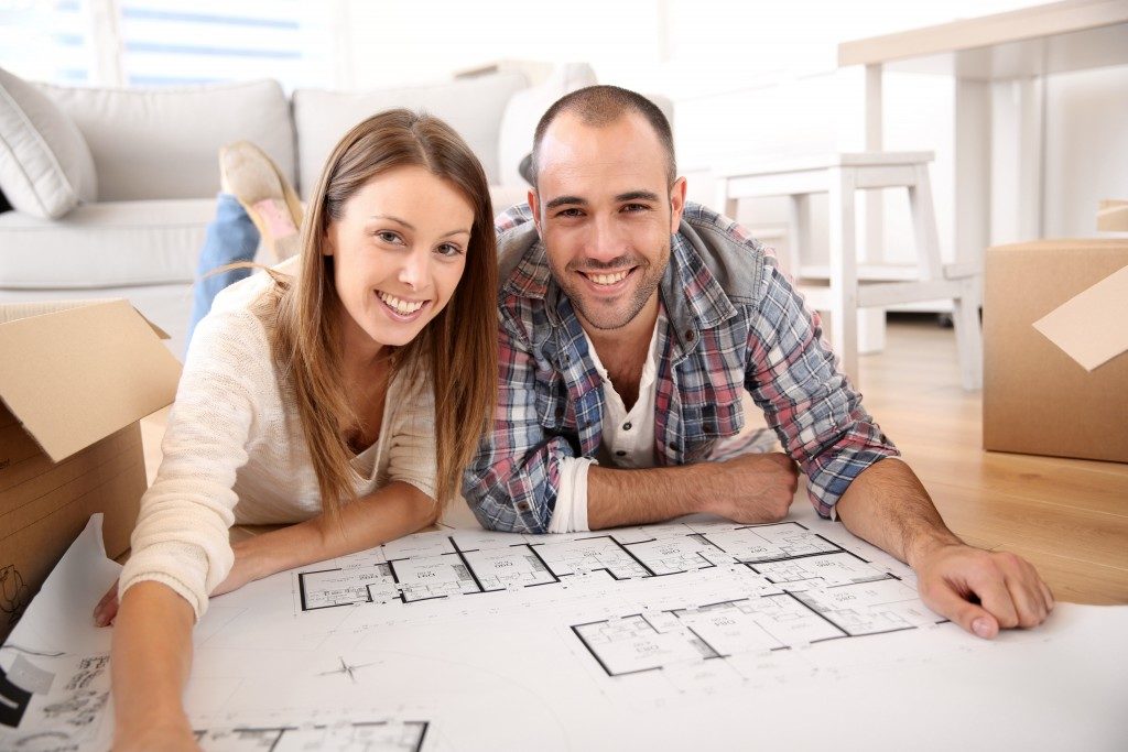 Couple checking the floor plan