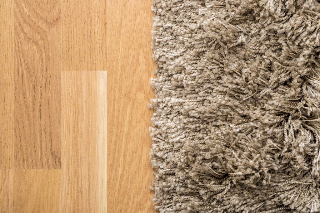 Fluffy carpet on the wooden floor