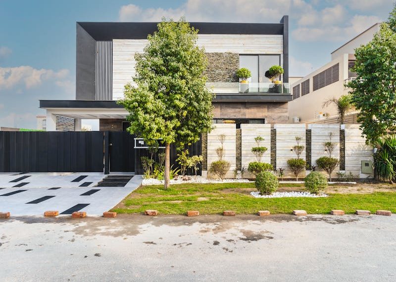 a modern house with a beautiful fence