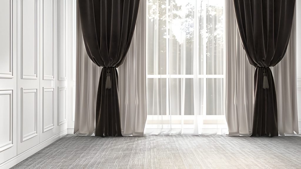 blackout curtains tied back over sheer curtains